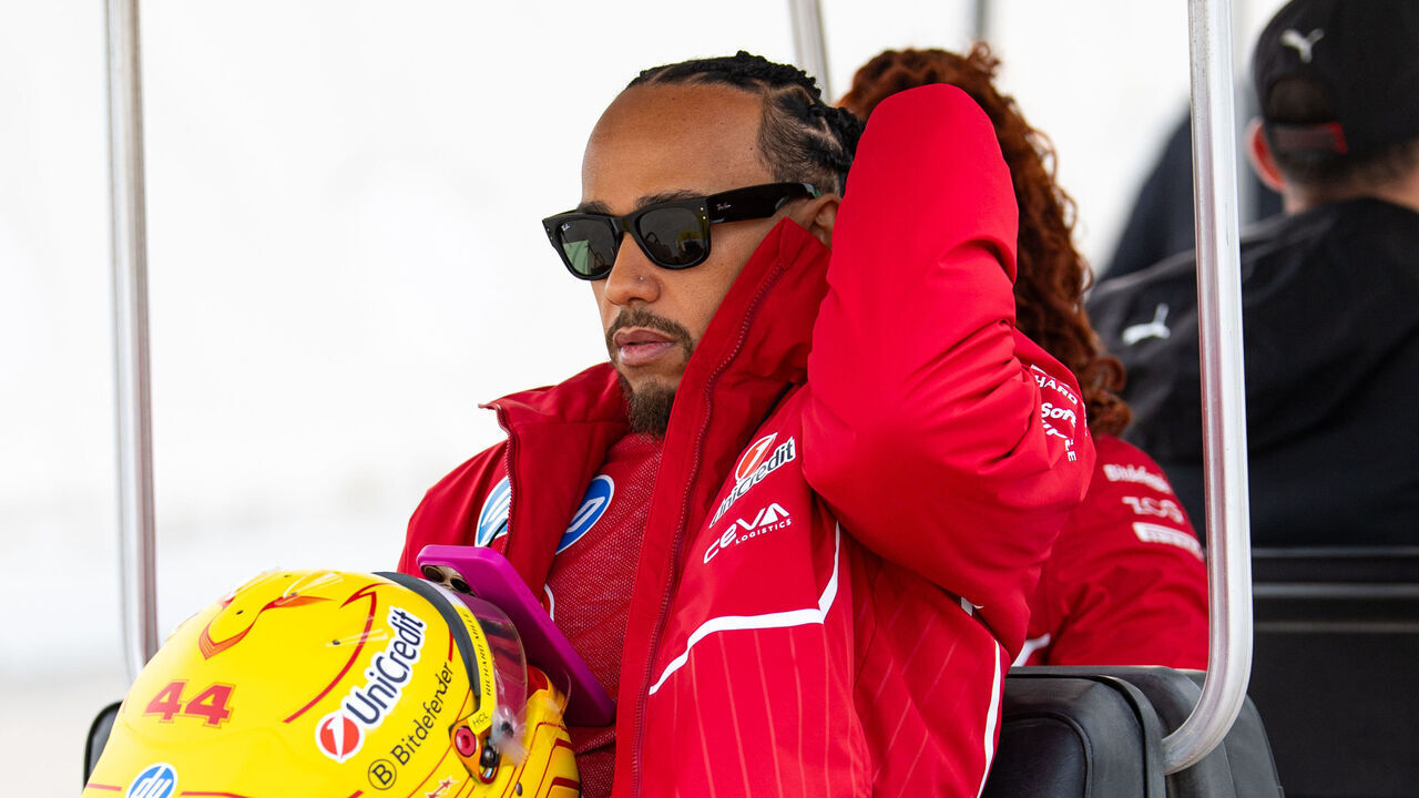BAHRAIN, BAHRAIN - FEBRUARY 26: Lewis Hamilton of Great Britain and Ferrari travels via buggy in the paddock during day one of F1 Testing at Bahrain International Circuit on February 26, 2025 in Bahrain, Bahrain.