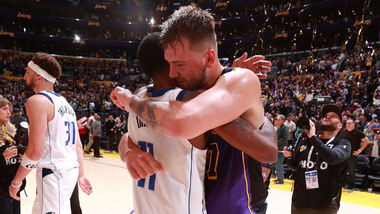 LOS ANGELES, CA - FEBRUARY 25: Kyrie Irving #11 of the Dallas Mavericks and Luka Doncic #77 of the Los Angeles Lakers embrace after the game on February 25, 2025 at Crypto.Com Arena in Los Angeles, California. NOTE TO USER: User expressly acknowledges and agrees that, by downloading and/or using this Photograph, user is consenting to the terms and conditions of the Getty Images License Agreement. Mandatory Copyright Notice: Copyright 2025 NBAE