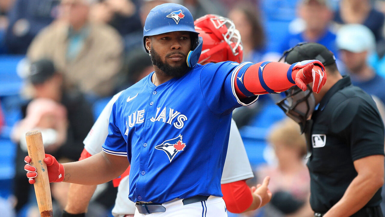 DUNEDIN, FL - FEBRUARY 25: Toronto Blue Jays DH Vladimir Guerrero Jr. (27) points at a friend in the St. Louis dugout during the spring training game between the St. Louis Cardinals and the Toronto Blue Jays on February 25, at the TD Ballpark in Dunedin, FL.