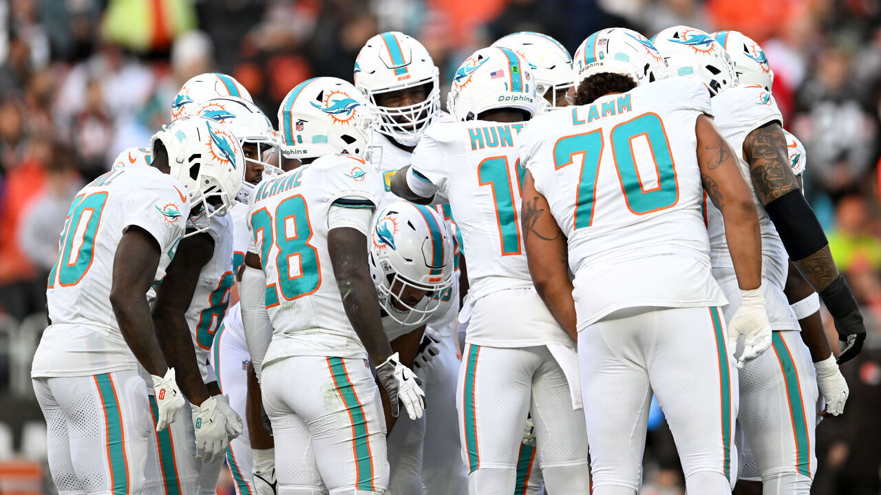 CLEVELAND, OHIO - DECEMBER 29: The Miami Dolphins offense huddles during the first quarter against the Cleveland Browns at Huntington Bank Field on December 29, 2024 in Cleveland, Ohio.