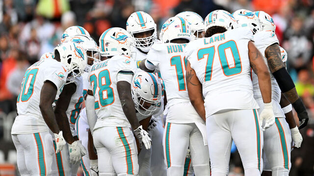 CLEVELAND, OHIO - DECEMBER 29: The Miami Dolphins offense huddles during the first quarter against the Cleveland Browns at Huntington Bank Field on December 29, 2024 in Cleveland, Ohio.