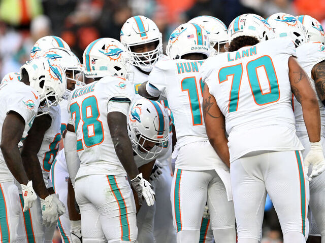 CLEVELAND, OHIO - DECEMBER 29: The Miami Dolphins offense huddles during the first quarter against the Cleveland Browns at Huntington Bank Field on December 29, 2024 in Cleveland, Ohio.
