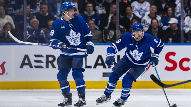 TORONTO, ON - JANUARY 20: Chris Tanev #8 and William Nylander #88 of the Toronto Maple Leafs skate against the Tampa Bay Lightning during the first period at the Scotiabank Arena on January 20, 2025 in Toronto, Ontario, Canada.
