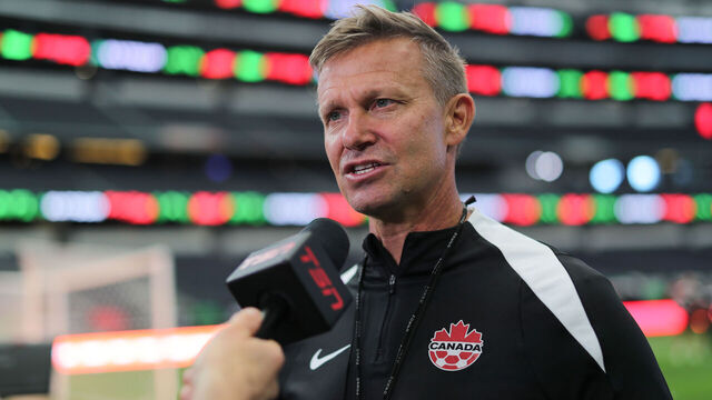 ARLINGTON, TEXAS - SEPTEMBER 09: Head Coach Jesse Marsch of Canada speaks during a mix zone ahead of the match against Mexico at AT&T Stadium on September 9, 2024 in Arlington, Texas.