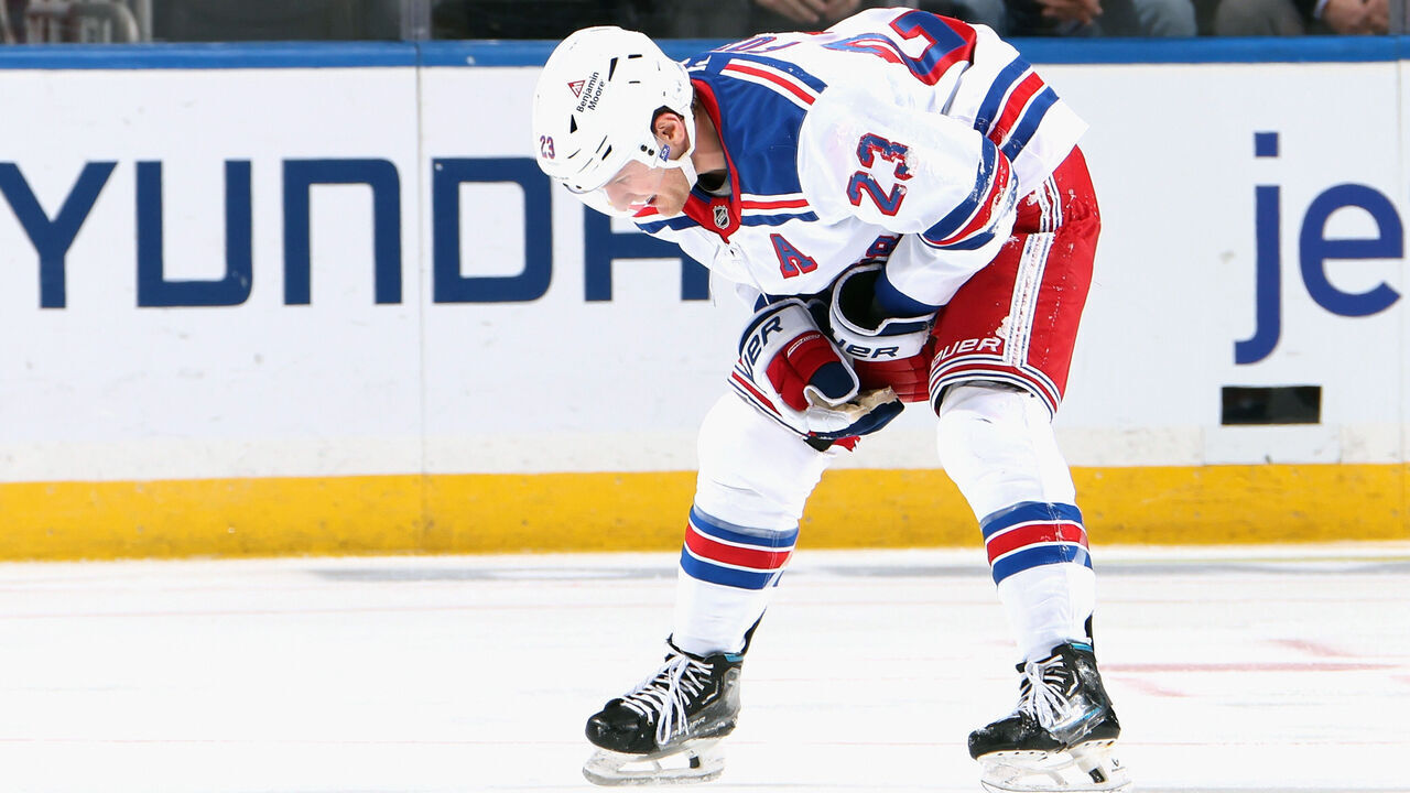 ELMONT, NEW YORK - FEBRUARY 25: Adam Fox #23 of the New York Rangers leaves the ice after an injury during the third period against the New York Islanders at UBS Arena on February 25, 2025 in Elmont, New York.