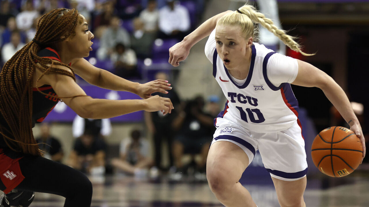 FORT WORTH, TX-FEBRUARY 26: Hailey Van Lith #10 of the TCU Horned Frogs dribbles the ball to the basket as Gigi Cooke #3 of the Houston Cougars defends in the first half at Schollmaier Arena on February 26, 2025 in Fort Worth, Texas.