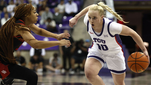 FORT WORTH, TX-FEBRUARY 26: Hailey Van Lith #10 of the TCU Horned Frogs dribbles the ball to the basket as Gigi Cooke #3 of the Houston Cougars defends in the first half at Schollmaier Arena on February 26, 2025 in Fort Worth, Texas.