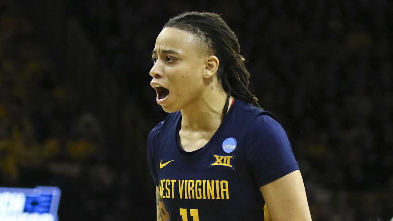 IOWA CITY, IOWA- MARCH 25: Guard J.J. Quinerly #11 of the West Virginia Mountaineers celebrates after a basket in the second half against the Iowa Hawkeyes during their second round match-up in the 2024 NCAA Division 1 Womens Basketball Championship at Carver-Hawkeye Arena on March 25, 2024 in Iowa City, Iowa.