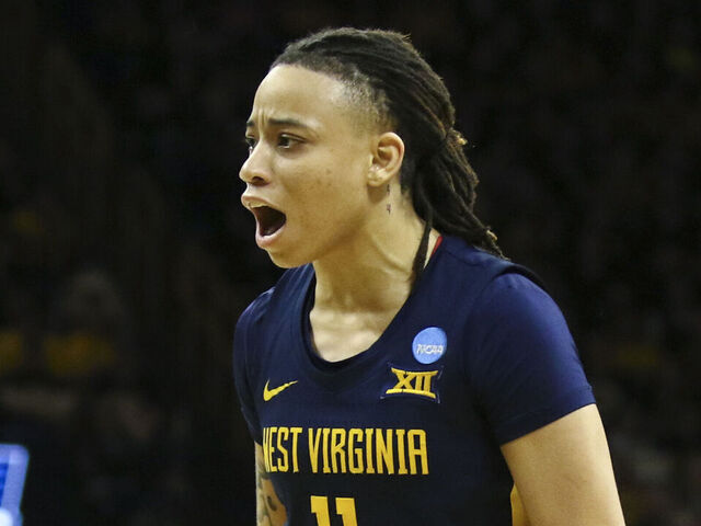 IOWA CITY, IOWA- MARCH 25: Guard J.J. Quinerly #11 of the West Virginia Mountaineers celebrates after a basket in the second half against the Iowa Hawkeyes during their second round match-up in the 2024 NCAA Division 1 Womens Basketball Championship at Carver-Hawkeye Arena on March 25, 2024 in Iowa City, Iowa.