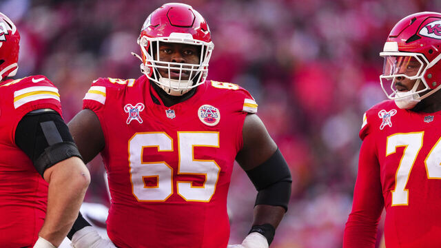 KANSAS CITY, MO - DECEMBER 21: Trey Smith #65 of the Kansas City Chiefs looks on from the field during an NFL football game against the Houston Texans at GEHA Field at Arrowhead Stadium on December 21, 2024 in Kansas City, Missouri.