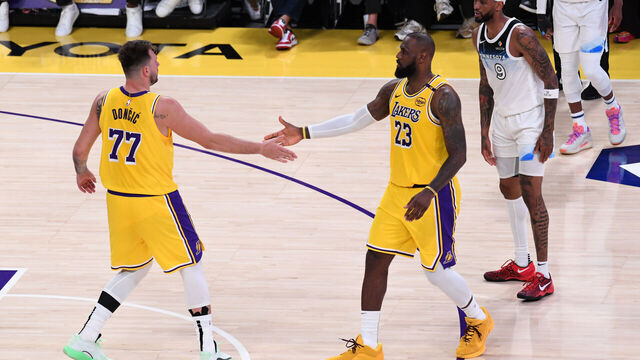 LOS ANGELES, CA - FEBRUARY 27: Luka Doncic #77 high fives LeBron James #23 of the Los Angeles Lakers during the game against the Minnesota Timberwolves on February 27, 2025 at Crypto.Com Arena in Los Angeles, California. NOTE TO USER: User expressly acknowledges and agrees that, by downloading and/or using this Photograph, user is consenting to the terms and conditions of the Getty Images License Agreement. Mandatory Copyright Notice: Copyright 2025 NBAE