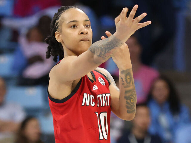 CHAPEL HILL, NC - FEBRUARY 16: NC State Wolfpack guard Aziaha James (10) celebrates the three point basket during the college basketball game between the North Carolina Tar Heels and the NC State Wolfpack on February 16, 2025 at Carmichael Arena in Chapel Hill, NC.