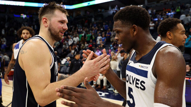MINNEAPOLIS, MINNESOTA - OCTOBER 29: Luka Doncic #77 of the Dallas Mavericks and Anthony Edwards #5 of the Minnesota Timberwolves shake hands after the game at Target Center on October 29, 2024 in Minneapolis, Minnesota. The Mavericks defeated the Timberwolves 120-114.