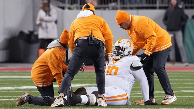 COLUMBUS, OHIO - DECEMBER 21: Elijah Simmons #10 of the Tennessee Volunteers is checked by trainers after an injury during the third quarter against the Ohio State Buckeyes in the Playoff First Round Game at Ohio Stadium on December 21, 2024 in Columbus, Ohio.