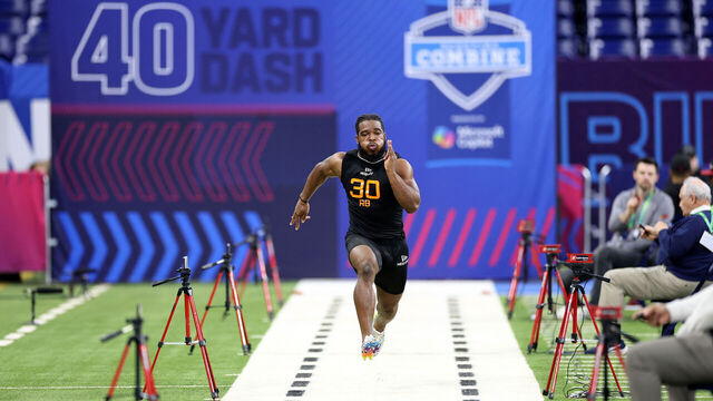 INDIANAPOLIS, INDIANA - MARCH 01: Bhayshul Tuten #RB30 of Virginia Tech participates in a drill during the NFL Scouting Combine at Lucas Oil Stadium on March 01, 2025 in Indianapolis, Indiana.