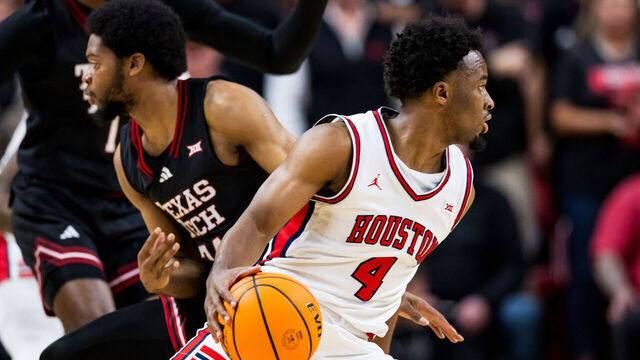 LUBBOCK, TEXAS - FEBRUARY 24: LJ Cryer #4 of the Houston Cougars handles the ball against Kerwin Walton #24 of the Texas Tech Red Raiders during the first half of the game at United Supermarkets Arena on February 24, 2025 in Lubbock, Texas.