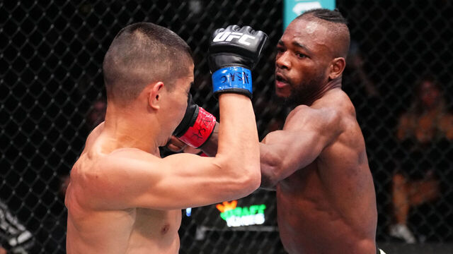 LAS VEGAS, NEVADA - MARCH 01: (R-L) Manel Kape of Angola punches Asu Almabayev of Kazakstan in a flyweight fight during the UFC Fight Night event at UFC APEX on March 01, 2025 in Las Vegas, Nevada.