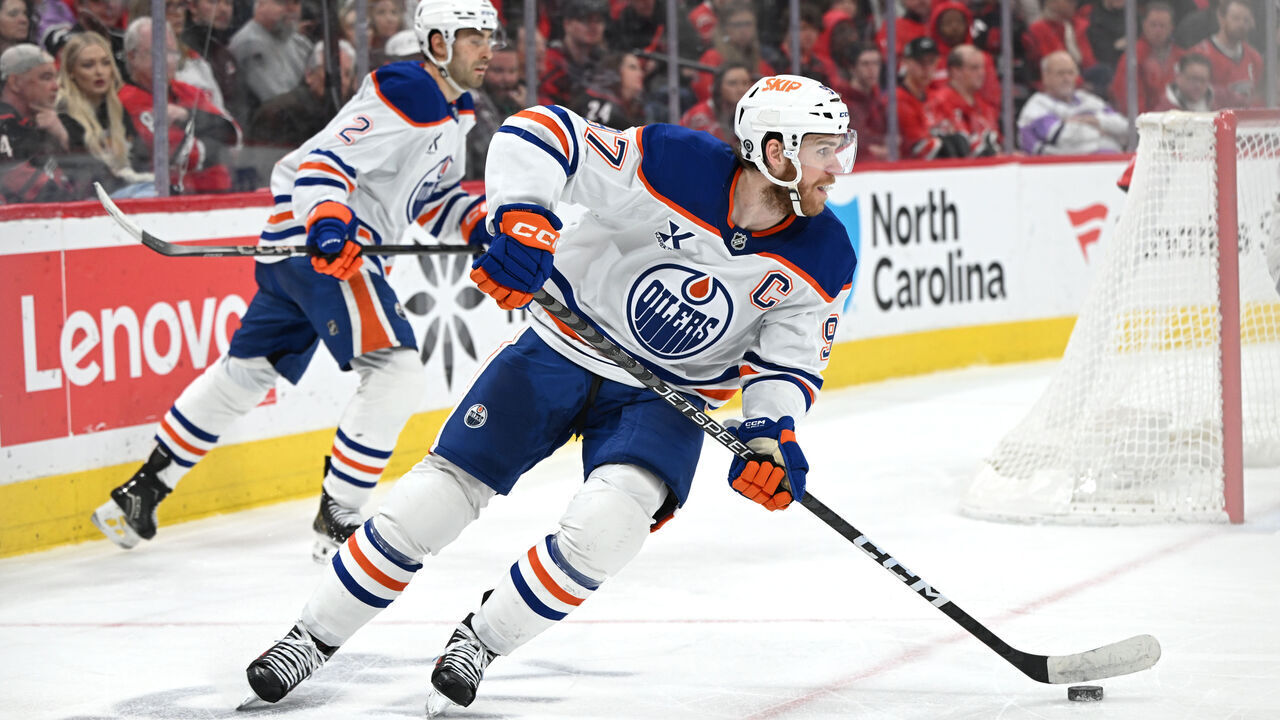 RALEIGH, NC - MARCH 01: Edmonton Oilers center Connor McDavid (97) takes possession of the puck during the NHL game between the Edmonton Oilers and the Carolina Hurricanes on March 1, 2025 at Lenovo Center in Raleigh, North Carolina.