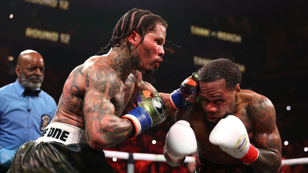 NEW YORK, NEW YORK - MARCH 01: Gervonta Davis punches Lamont Roach Jr. during their bout for Davis' WBA lightweight title at Barclays Center on March 01, 2025 in New York City.