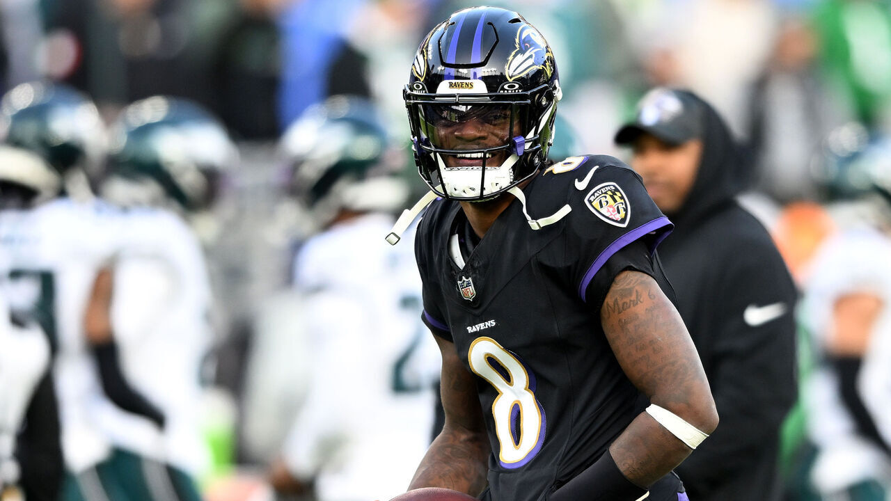 BALTIMORE, MARYLAND - DECEMBER 01: Lamar Jackson #8 of the Baltimore Ravens warms up before the game against the Philadelphia Eagles at M&T Bank Stadium on December 01, 2024 in Baltimore, Maryland.
