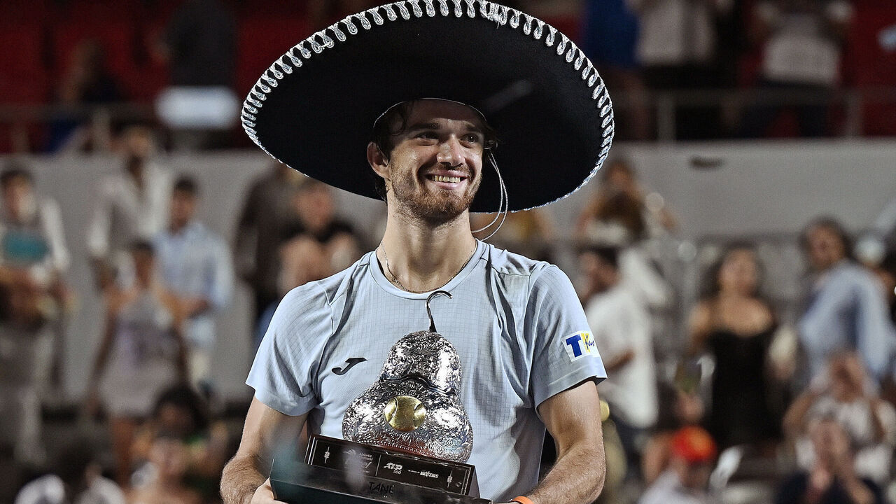 Czech Republic's Tomas Machac holds up the trophy after beating Spain's Alejandro Davidovich Fokina during their 2025 Mexico ATP Open 500 men´s singles tennis final match at the Arena GNP Seguros in Acapulco, Guerrero State, Mexico on March 1, 2025.