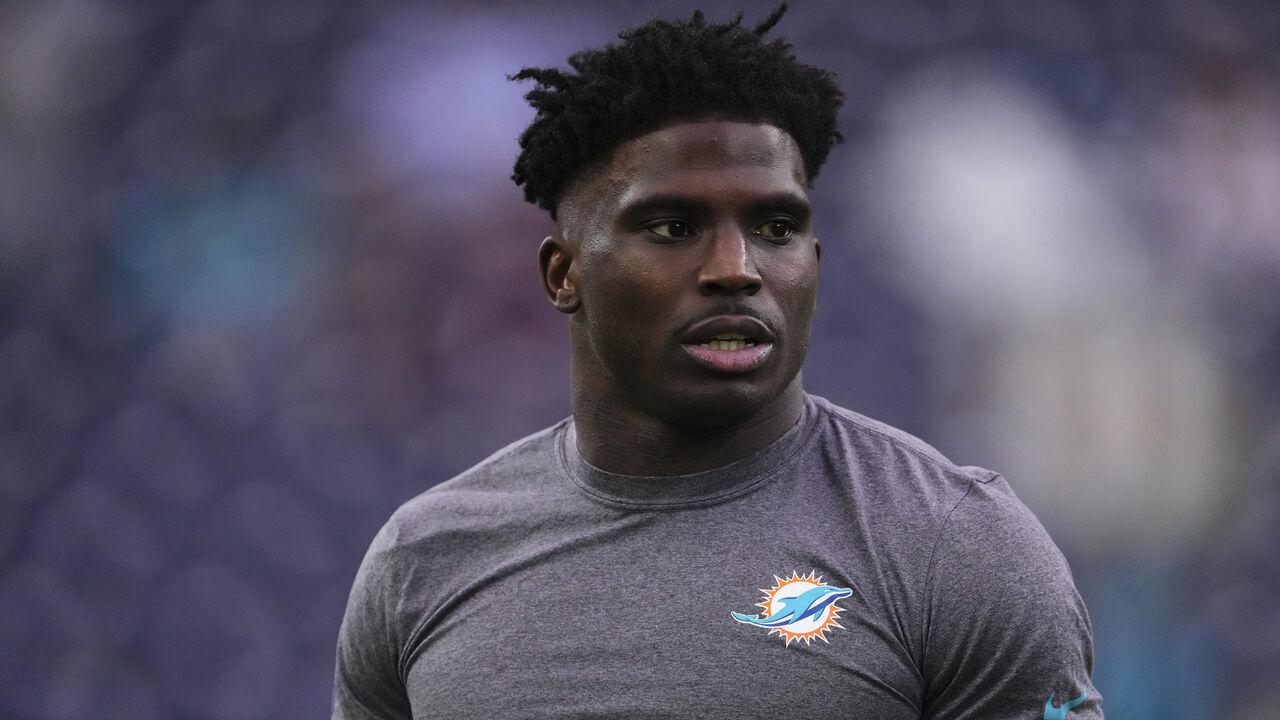 HOUSTON, TX - DECEMBER 15: Tyreek Hill #10 of the Miami Dolphins warms up before kickoff against the Houston Texans during an NFL football game at NRG Stadium on December 15, 2024 in Houston, Texas.