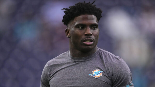 HOUSTON, TX - DECEMBER 15: Tyreek Hill #10 of the Miami Dolphins warms up before kickoff against the Houston Texans during an NFL football game at NRG Stadium on December 15, 2024 in Houston, Texas.