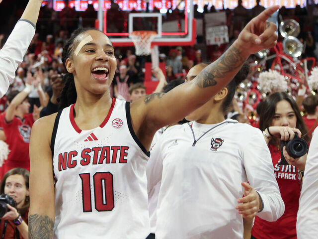 RALEIGH, NC - FEBRUARY 23: NC State Wolfpack guard Aziaha James (10) points to the crowd during the college basketball game between the NC State Wolfpack and the Notre Dame Fighting Irish on February 23, 2025 at Reynolds Coliseum in Raleigh, NC.