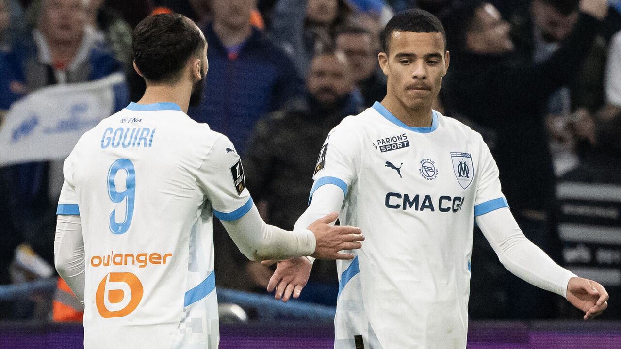 Marseille's Algerian forward #09 Amine Gouiri (L) celebrates with Marseille's British forward #10 Mason Greenwood after scoring a goal during the French L1 football match between Olympique de Marseille (OM) and FC Nantes at the Velodrome Stadium in Marseille, southeastern France, on March 2, 2025.