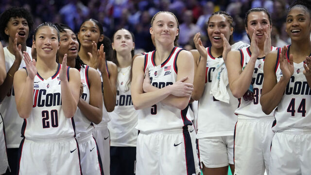 STORRS, CONNECTICUT - MARCH 2: Paige Bueckers #5 of the Connecticut Huskies reacts as she is inducted into the Huskies of Honor program following an NCAA women's basketball game against the Marquette Golden Eagles at the Harry A. Gampel Pavilion on March 2, 2025 in Storrs, Connecticut.
