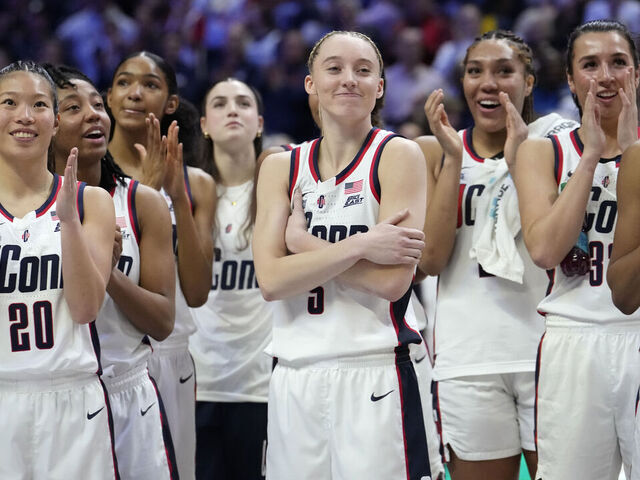 STORRS, CONNECTICUT - MARCH 2: Paige Bueckers #5 of the Connecticut Huskies reacts as she is inducted into the Huskies of Honor program following an NCAA women's basketball game against the Marquette Golden Eagles at the Harry A. Gampel Pavilion on March 2, 2025 in Storrs, Connecticut.