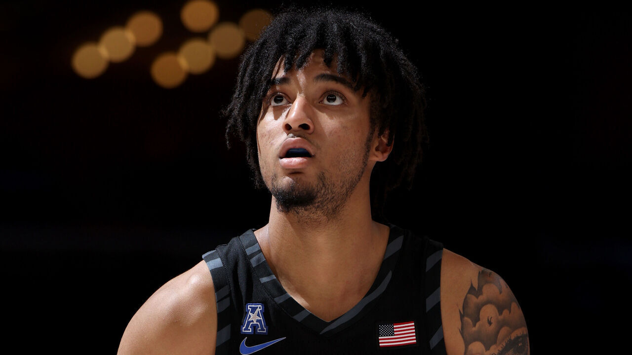 MEMPHIS, TN - FEBRUARY 26: PJ Haggerty #4 of the Memphis Tigers shoots a free throw against the Rice Owls during the second half on February 26, 2025 at FedExForum in Memphis, Tennessee.