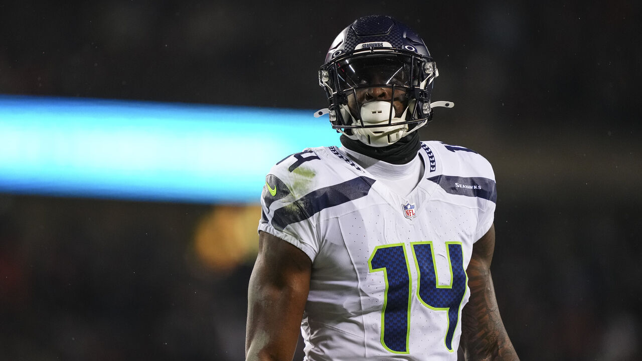 CHICAGO, IL - DECEMBER 26: DK Metcalf #14 of the Seattle Seahawks looks on from the field during an NFL football game against the Chicago Bears at Soldier Field on December 26, 2024 in Chicago, Illinois.