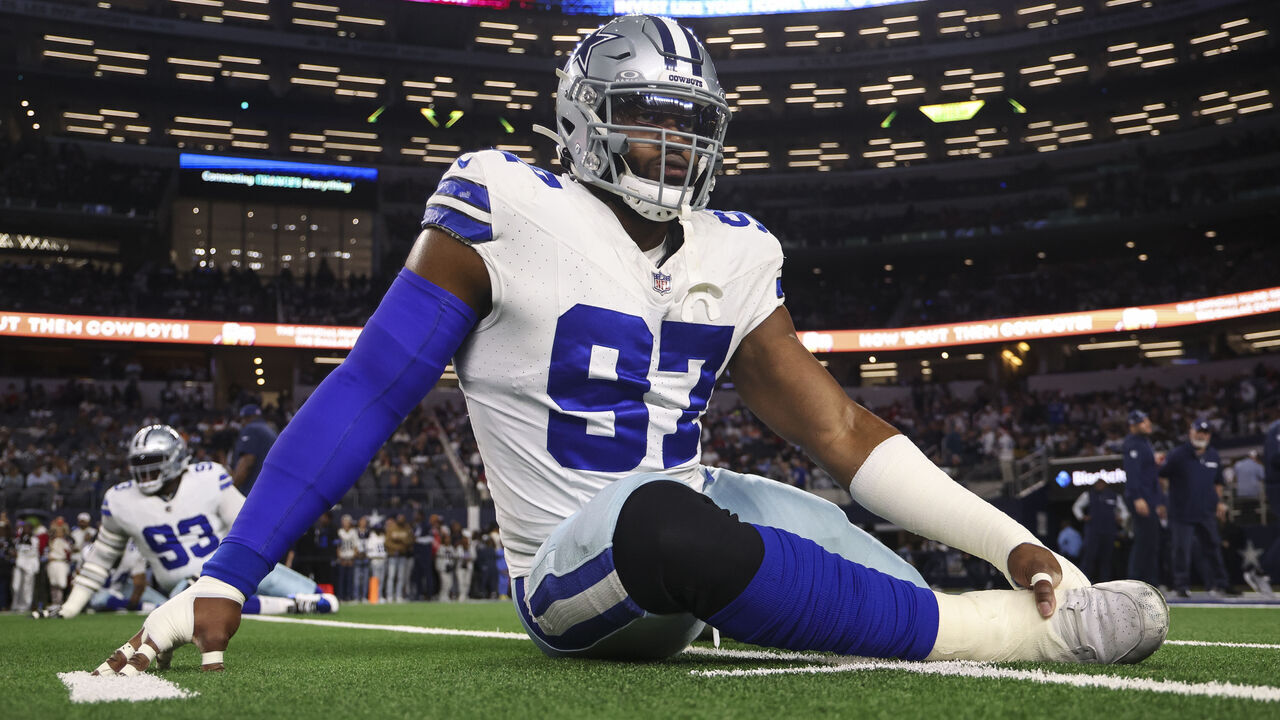 ARLINGTON, TEXAS - DECEMBER 22: Osa Odighizuwa #97 of the Dallas Cowboys warms up prior to an NFL football game against the Tampa Bay Buccaneers at AT&T Stadium on December 22, 2024 in Arlington, Texas.