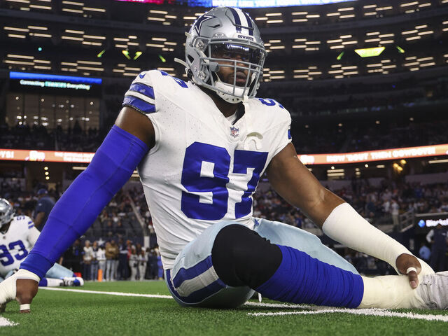 ARLINGTON, TEXAS - DECEMBER 22: Osa Odighizuwa #97 of the Dallas Cowboys warms up prior to an NFL football game against the Tampa Bay Buccaneers at AT&T Stadium on December 22, 2024 in Arlington, Texas.