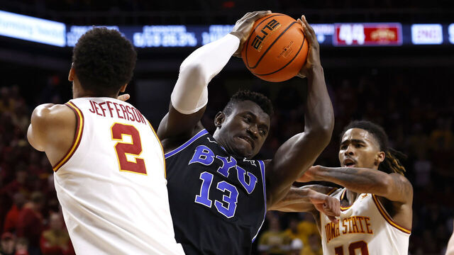 AMES, IA - MARCH 4: Keba Keita #13 of the Brigham Young Cougars battles for a rebound against Joshua Jefferson #2 and Keshon Gilbert #10 of the Iowa State Cyclones in the second half at Hilton Coliseum on March 4, 2025, in Ames, Iowa. The Brigham Young Cougars won 88-85 over the Iowa State Cyclones.