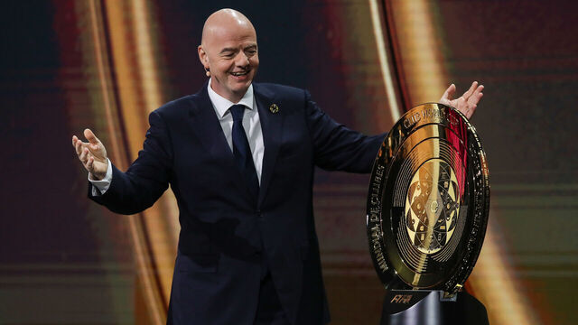 MIAMI, FLORIDA - DECEMBER 05: FIFA President Gianni Infantino presents The FIFA Club World Cup Trophy during the 2025 FIFA Club World Cup Draw at Telemundo Studios on December 05, 2024 in Miami, Florida.