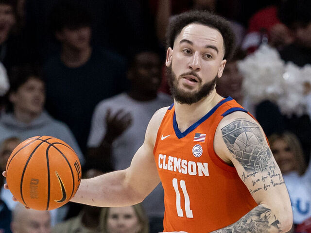 DALLAS, TX - FEBRUARY 22: Clemson Tigers guard Jaeden Zackery (#11) dribbles up court during the college basketball game between the SMU Mustangs and the Clemson Tigers on February 22, 2025, at Moody Coliseum in Dallas, TX.