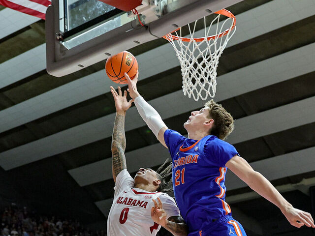 TUSCALOOSA, ALABAMA - MARCH 5: Alex Condon #21 of the Florida Gators blocks a second half shot attempt from Labaron Philon #0 of the Alabama Crimson Tide at Coleman Coliseum on March 5, 2025 in Tuscaloosa, Alabama.