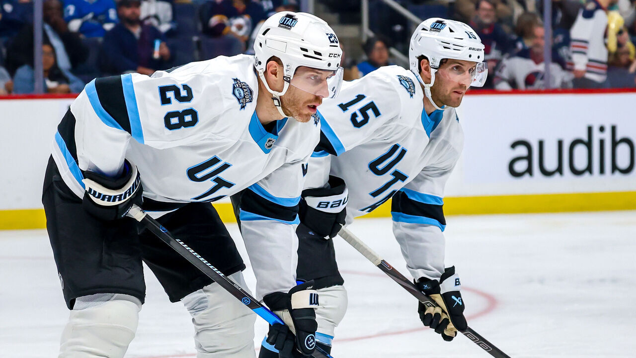 WINNIPEG, CANADA - NOVEMBER 05: Ian Cole #28 and Alexander Kerfoot #15 of the Utah Hockey Club prepare for a second period face-off against the Winnipeg Jets at Canada Life Centre on November 05, 2024 in Winnipeg, Manitoba, Canada.