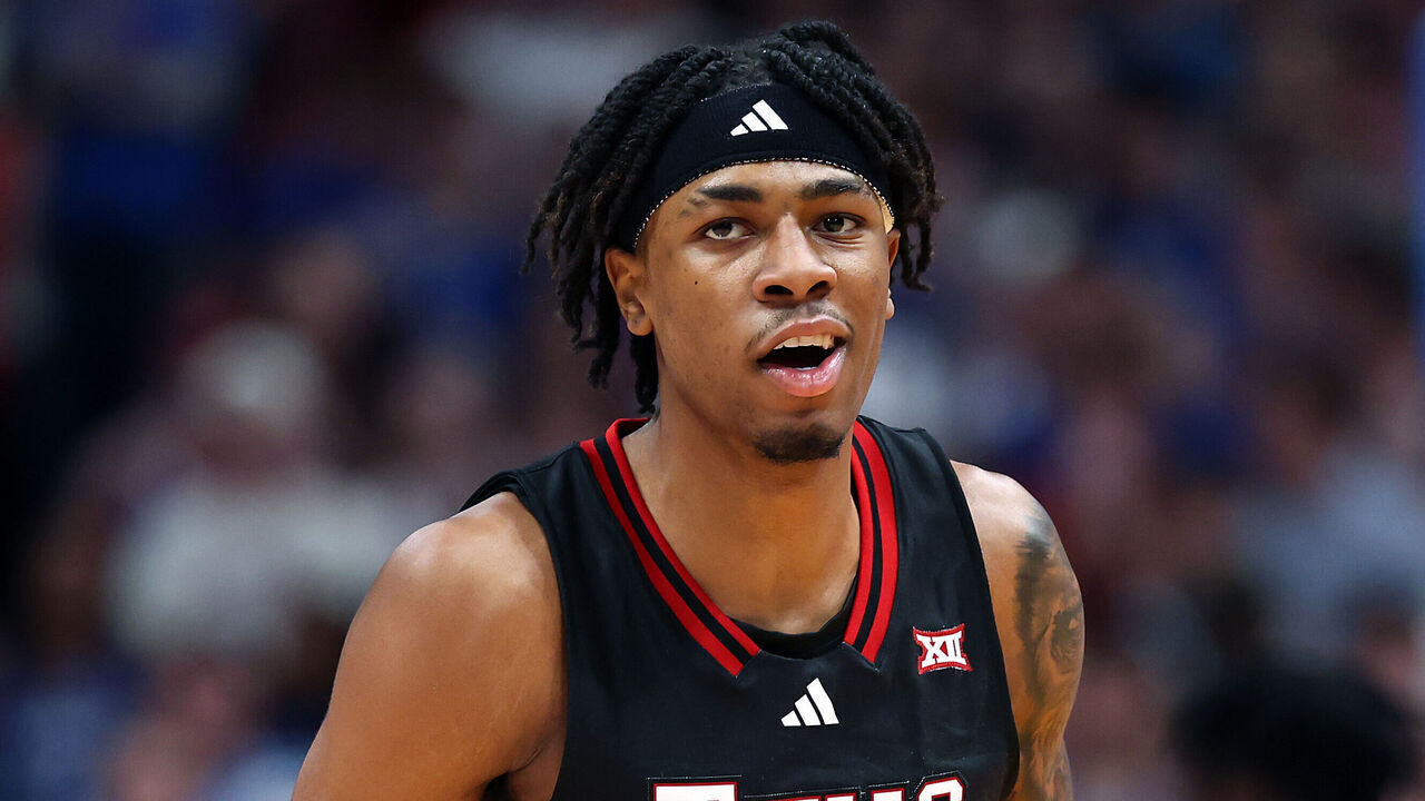 LAWRENCE, KANSAS - MARCH 01: JT Toppin #15 of the Texas Tech Red Raiders reacts after scoring during the second half of the game against the Kansas Jayhawks at Allen Fieldhouse on March 01, 2025 in Lawrence, Kansas.