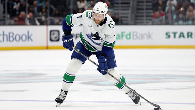 SEATTLE, WASHINGTON - MARCH 01: Carson Soucy #7 of the Vancouver Canucks shoots against the Seattle Kraken during the third period at Climate Pledge Arena on March 01, 2025 in Seattle, Washington.