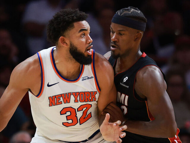 MIAMI, FLORIDA - OCTOBER 30: Jimmy Butler #22 of the Miami Heat defends against Karl-Anthony Towns #32 of the New York Knicks during the second half at Kaseya Center on October 30, 2024 in Miami, Florida.
