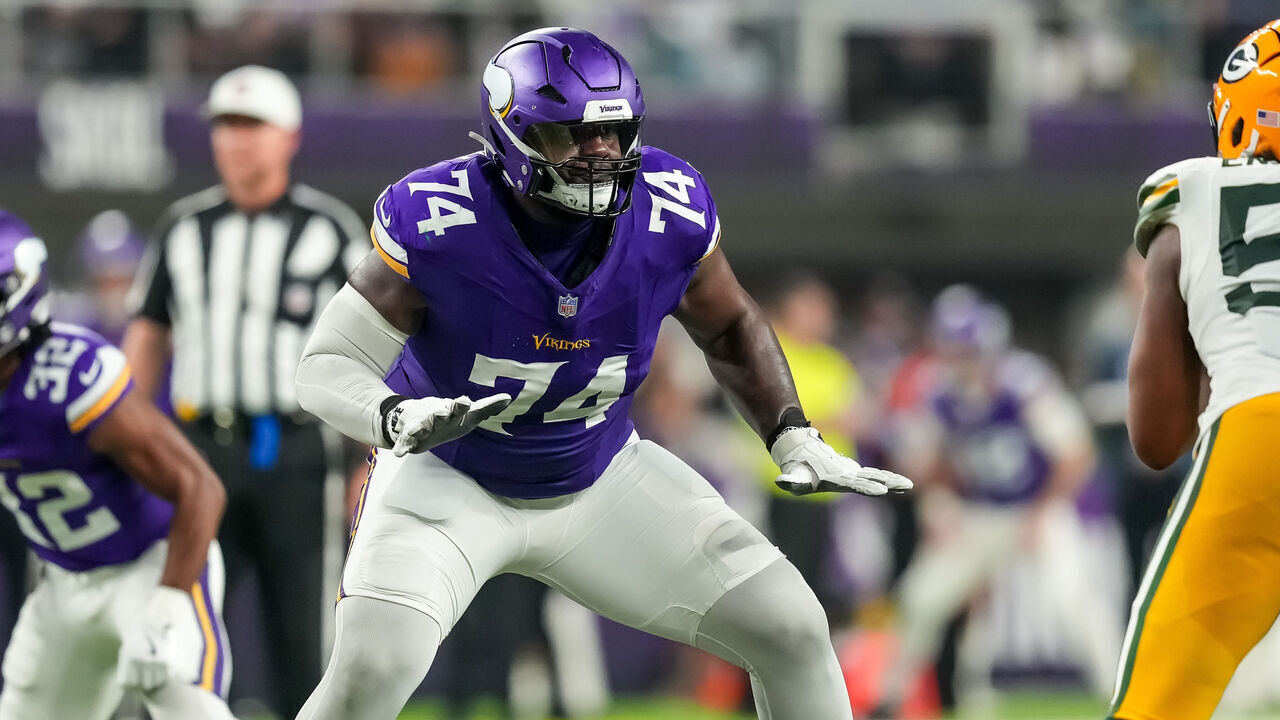 MINNEAPOLIS, MINNESOTA - DECEMBER 29: Cam Robinson #74 of the Minnesota Vikings blocks during a game between the Minnesota Vikings and Green Bay Packers at U.S. Bank Stadium on December 29, 2024 in Minneapolis, Minnesota.