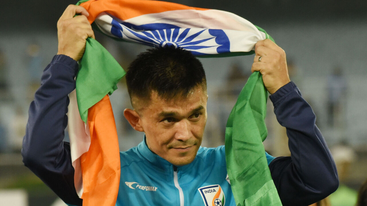 India's captain Sunil Chhetri is greeting his fans at the end of the FIFA World Cup 2026 Asia qualifier match between India and Kuwait at the Salt Lake Stadium in Kolkata, India, on June 6, 2024. Chhetri is receiving a standing ovation and is taking a heartfelt lap of honor, struggling to contain his emotions. His Indian teammates are forming a guard of honor to pay tribute to his illustrious career. As India's top goal-scorer is retiring with 94 goals, fans are bidding farewell with heavy hearts.