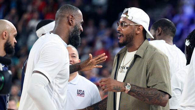 PARIS, FRANCE August 6, 2024-USA's LeBron James greets former NBA star and Olympian Carmelo Anthony after defeating Brazil in the quarterfinals at the 2024 Paris Olympics Tuesday. (Skalij/Los Angeles Times via Getty Images)
