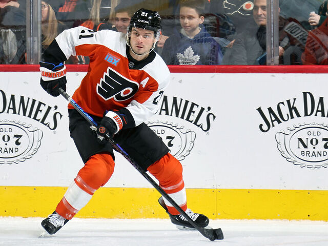 PHILADELPHIA, PENNSYLVANIA - JANUARY 07: Scott Laughton #21 of the Philadelphia Flyers skates the puck against the Toronto Maple Leafs at the Wells Fargo Center on January 7, 2025 in Philadelphia, Pennsylvania.