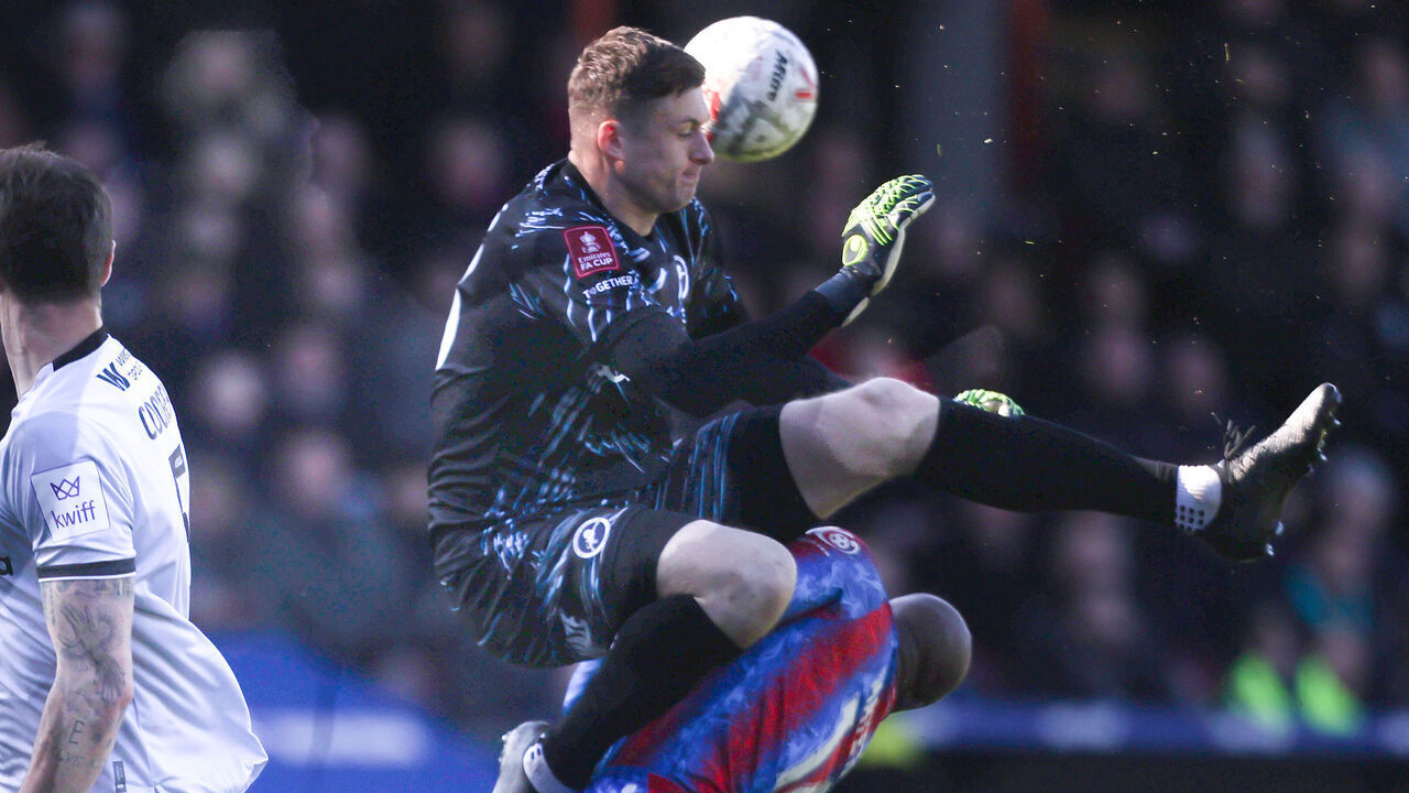 LONDON, ENGLAND - MARCH 1: Millwall's Liam Roberts fouls Crystal Palace's Jean-Philippe Mateta which resulted in him receiving a recd card during the Emirates FA Cup Fifth Round match between Crystal Palace and Millwall at Selhurst Park on March 1, 2025 in London, England.