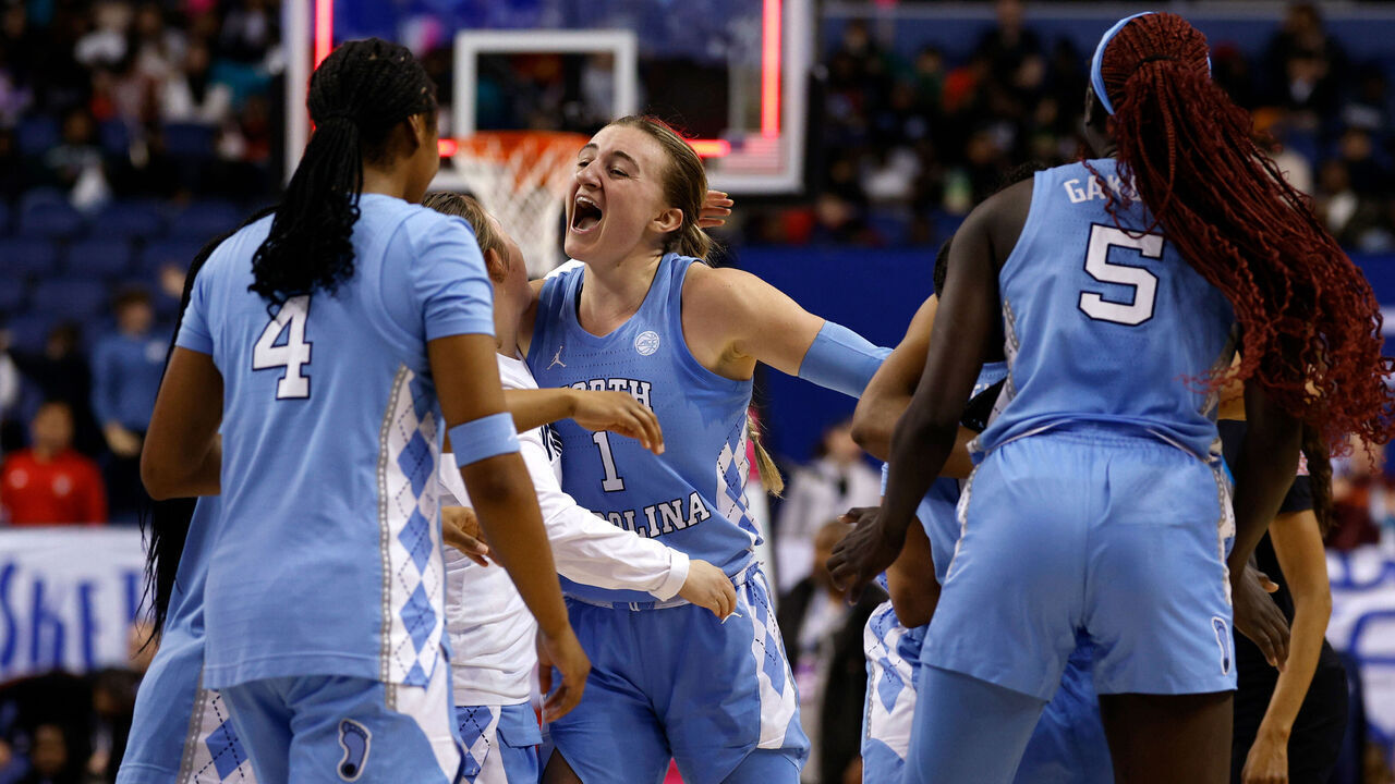 GREENSBORO, NORTH CAROLINA - MARCH 7: Alyssa Ustby #1 of the North Carolina Tar Heels celebrates with teammates following their win against the Florida State Seminoles in a quarterfinals game of the ACC women's basketball tournament at First Horizon Coliseum on March 7, 2025 in Greensboro, North Carolina.