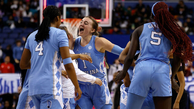 GREENSBORO, NORTH CAROLINA - MARCH 7: Alyssa Ustby #1 of the North Carolina Tar Heels celebrates with teammates following their win against the Florida State Seminoles in a quarterfinals game of the ACC women's basketball tournament at First Horizon Coliseum on March 7, 2025 in Greensboro, North Carolina.